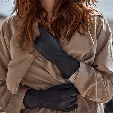 model wearing a trench coat and leather gloves