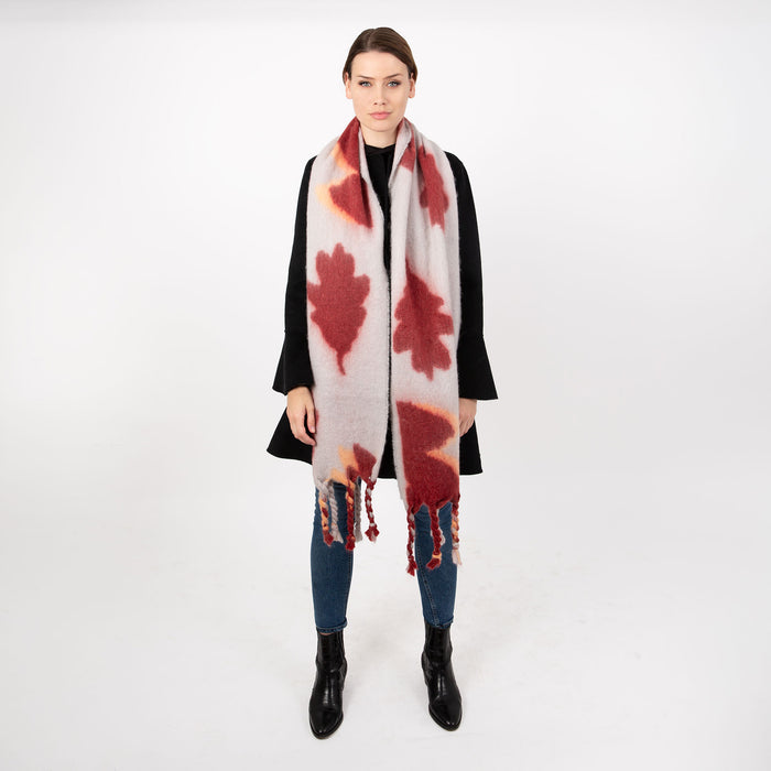 Woman wearing abstract pattern blanket scarf in mist grey
