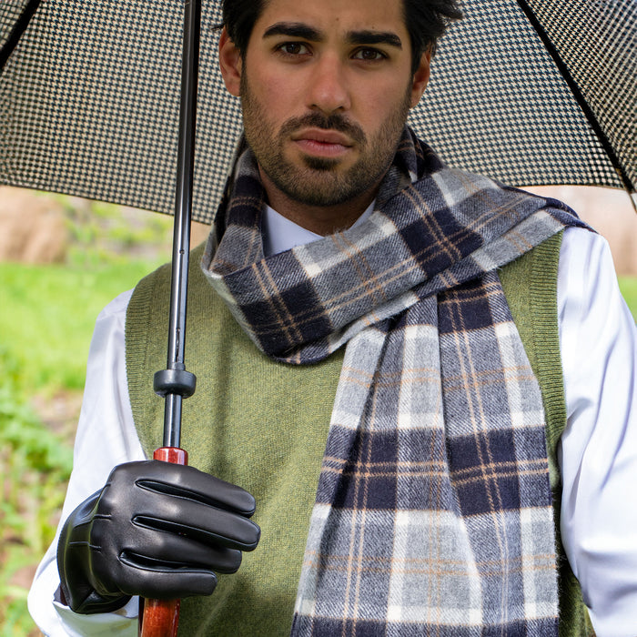 Man wearing heritage cashmere scarf with tassels in silver bannockbane