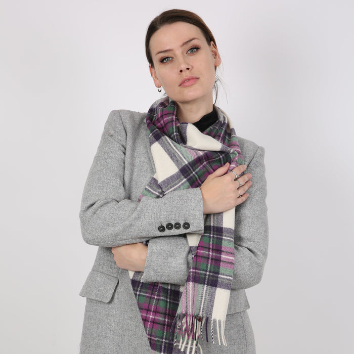 Woman wearing a Heritage plaid check cashmere scarf in ivory