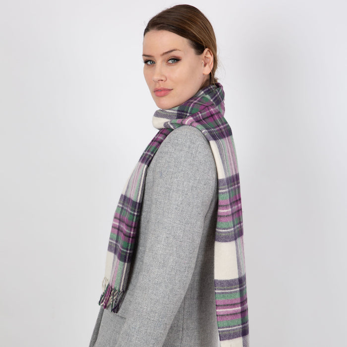 Woman wearing a Heritage plaid check cashmere scarf in ivory