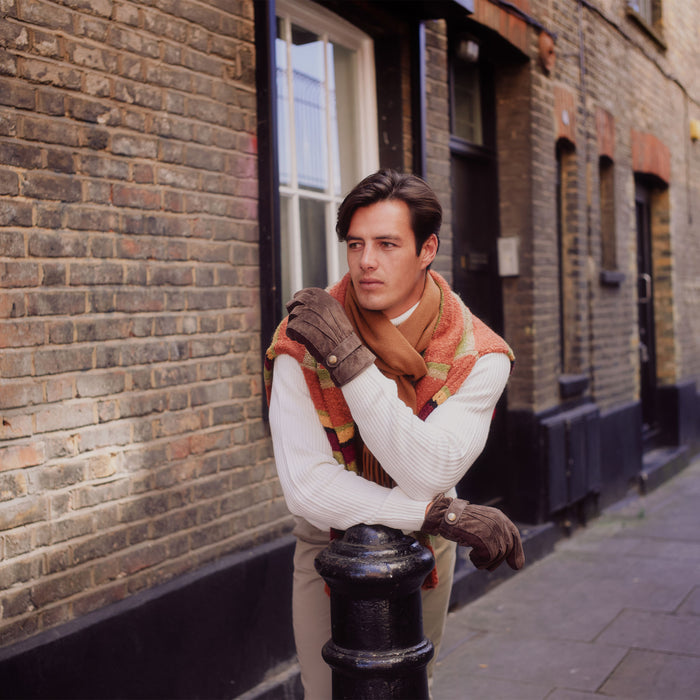 man wearing a lambswool scarf with tassels in vicuna