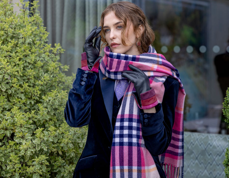 Woman wearing check navy pink scarf
