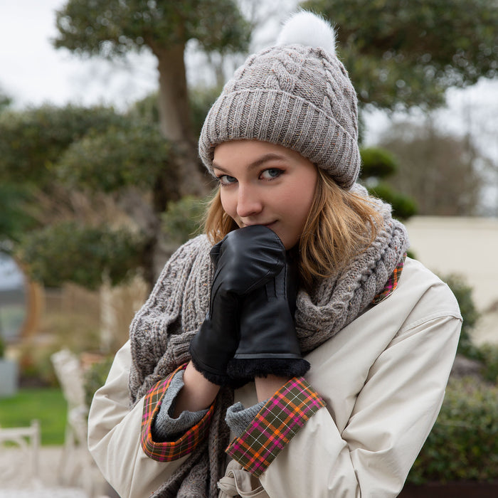 woman wearing black leather mittens on a walk