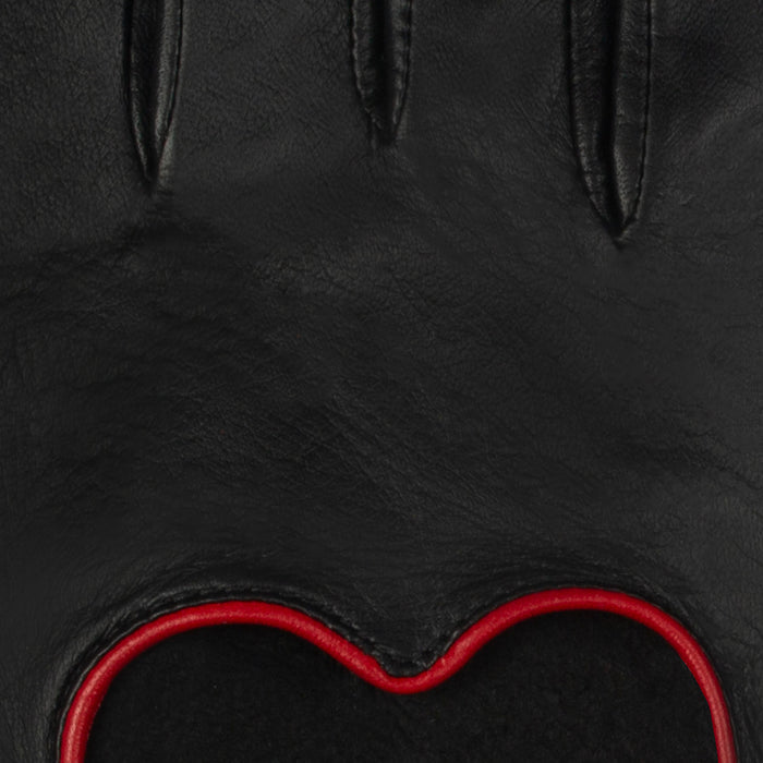 Women's leather driving gloves with heart cut out in black/berry - close up of the leather