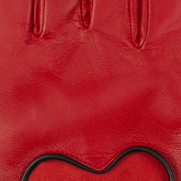 Women's leather driving gloves with heart cut out in berry/black - close up of the leather