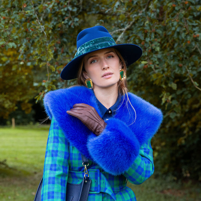 Woman wearing Women’s Touchscreen Three-Point Cashmere-Lined Leather Gloves with Buttons in mocca