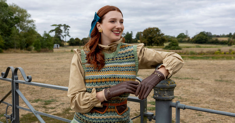 Woman wearing leather water-resistant gloves in chestnut