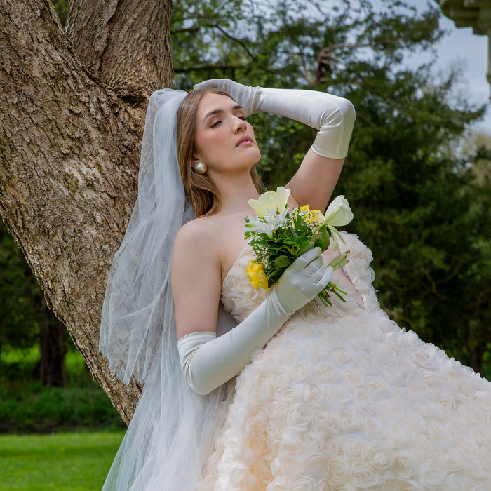 Woman wearing Women's Long Satin Gloves in White with wedding dress