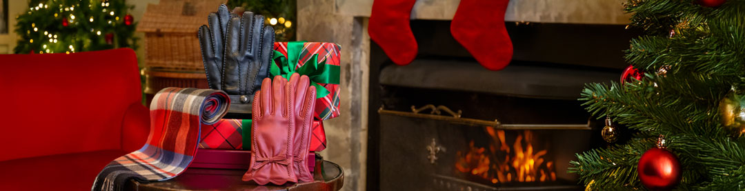 A cozy Christmas gift arrangement featuring a stack of wrapped presents.
