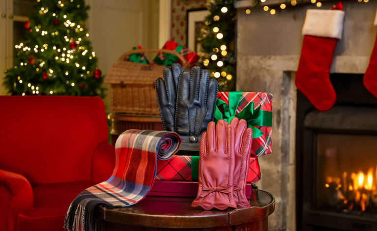 A cozy Christmas gift arrangement featuring a stack of wrapped presents.